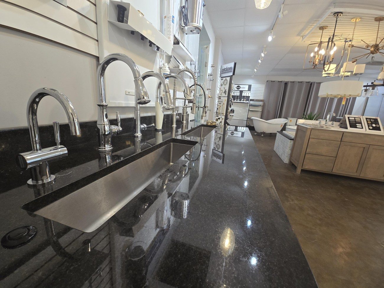 Kitchen sinks and faucets on display in the showroom