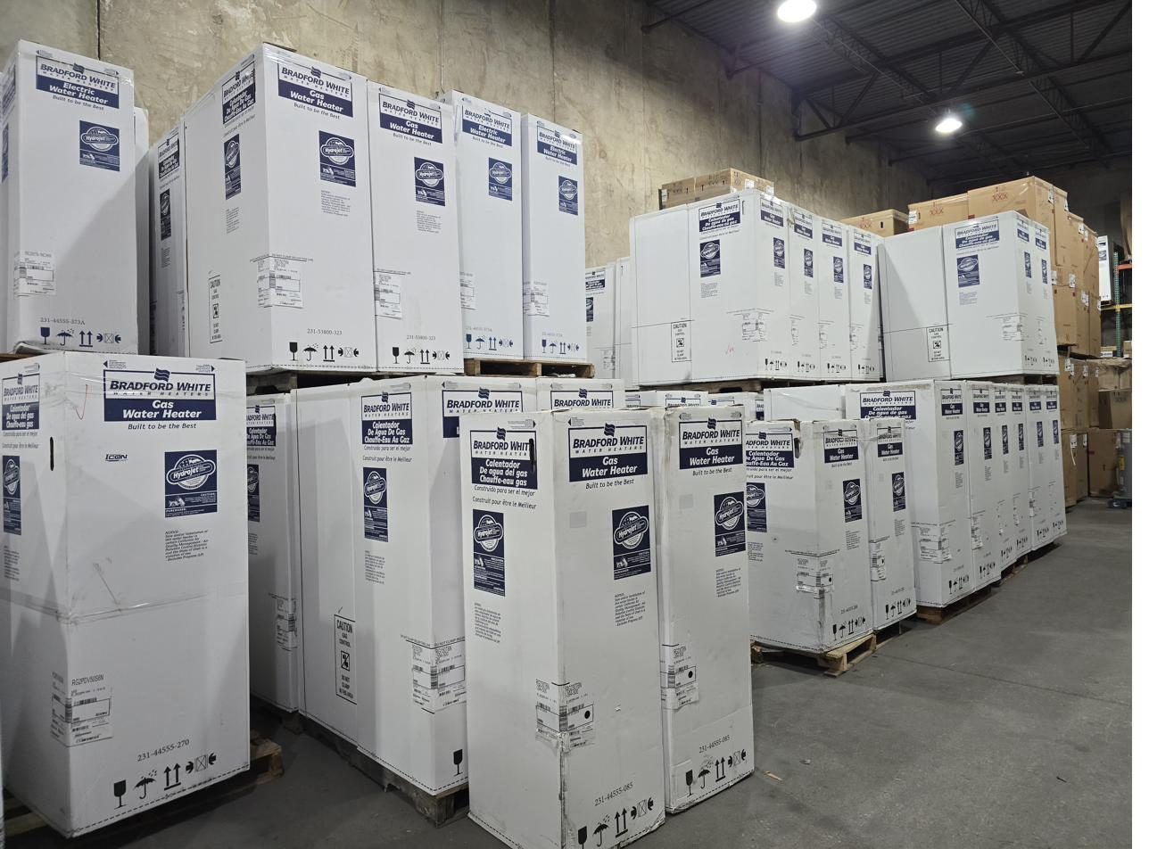 Pallets of Bradford White gas and electric water heaters stocked in Carrollton